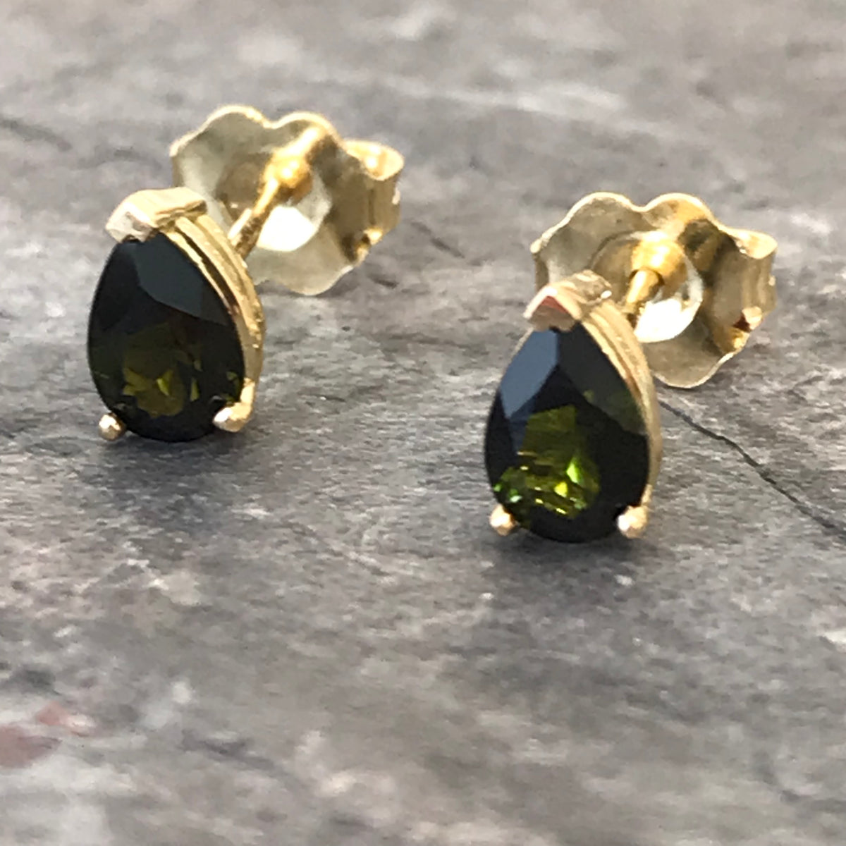 Handmade green tourmaline 18K gold stud earrings by Garden of Silver in Westhampton Beach. www.gardenofsilver.com