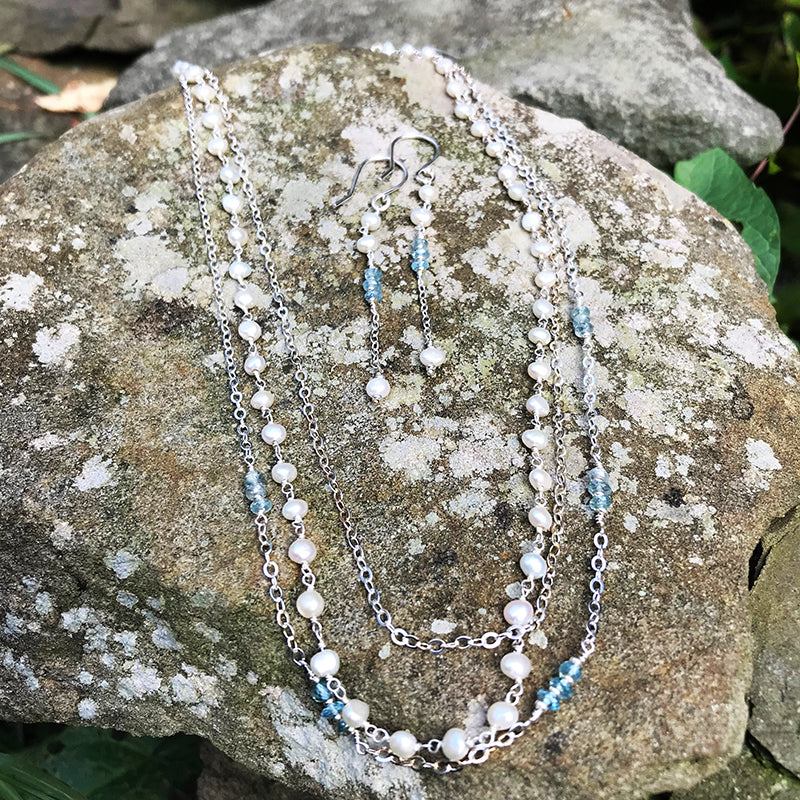 Sea Treasures Earrings and Necklace handmade by Garden of Silver with pearls and blue zircon gemstones and sterling silver.
