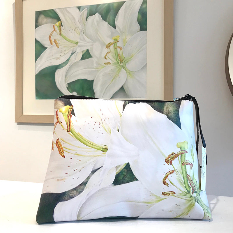 Lily Pair large clutch handmade in Italian nappa leather. Colored pencil artwork by Eileen Baumeister McIntyre. 77 Main Street, Westhampton Beach, NY.