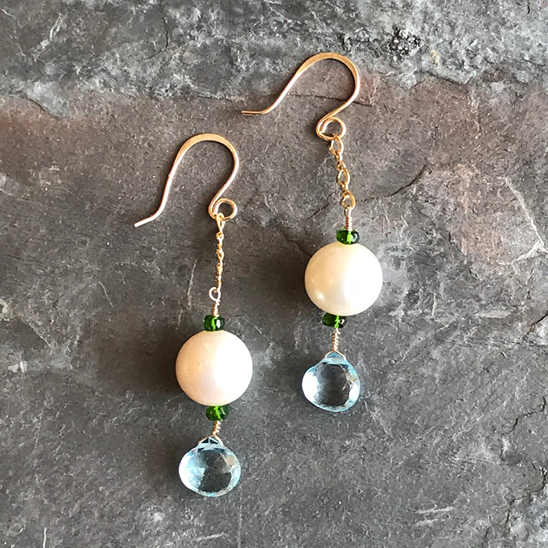 Seawater Earrings handmade jewelry by Garden of Silver in Westhampton Beach, New York. Pearls, blue topaz and chrome dioxide gemstones with gold.