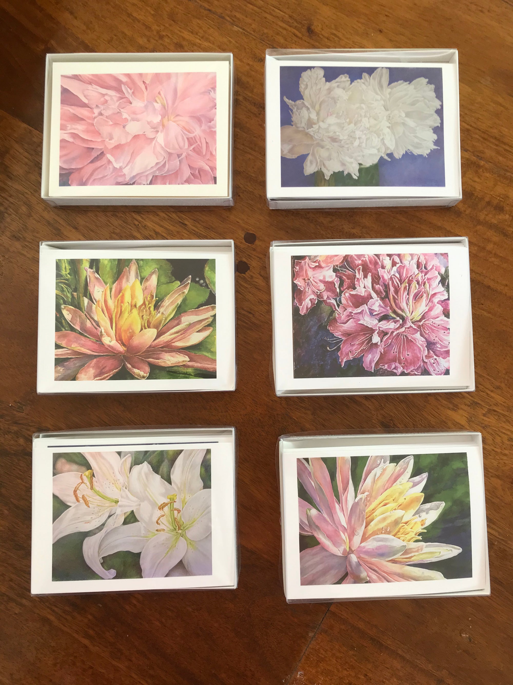 Set of 6 flower themed blank greeting cards from watercolor and colored pencil reproductions by Eileen Baumeister McIntyre. Each card is printed on watercolor paper, is 4.25" x 5.5" and comes with envelopes.