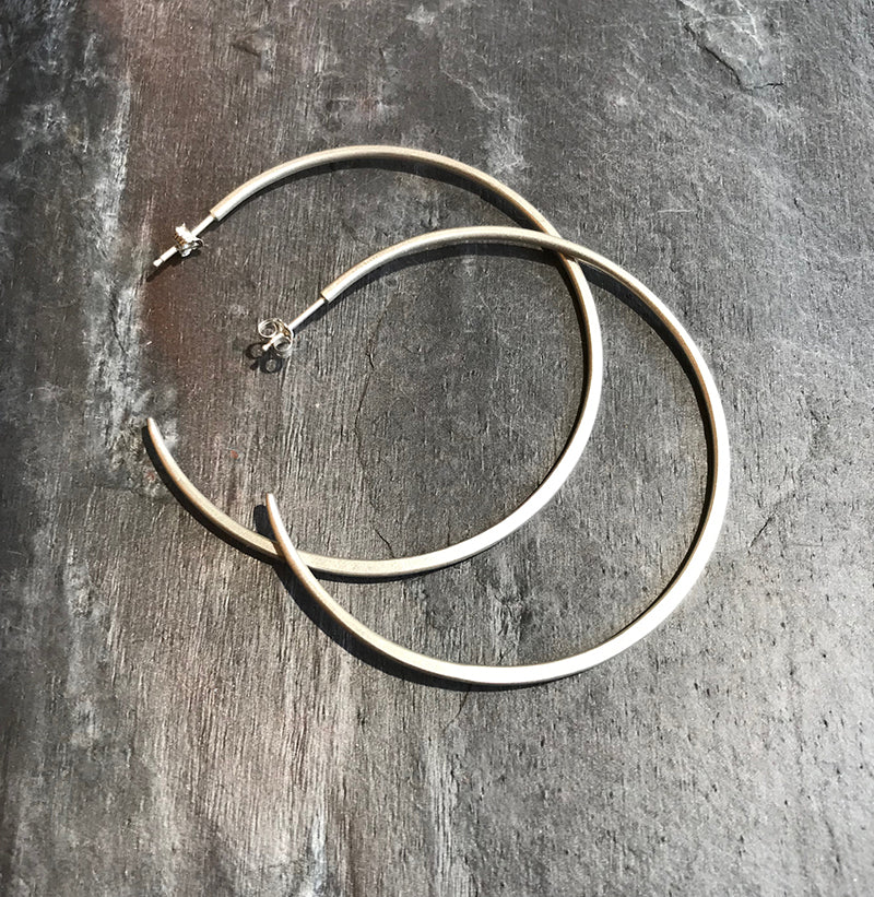 Large sterling hoop earrings by Colleen Mauer at Garden of Silver in Westhampton Beach, New York.